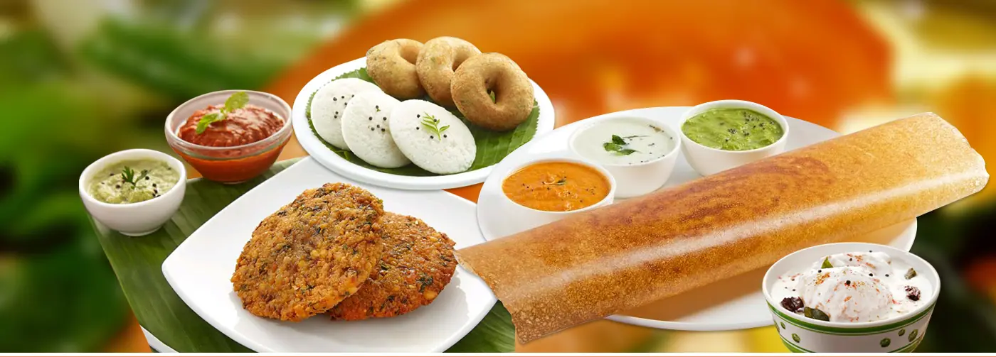 Idly, medu vada, masala vada and dosa with sambar and chutneys